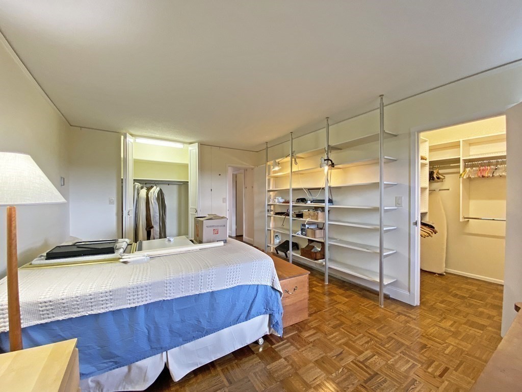 111 Perkins Street, Unit 186 Boston, MA 02130 - Photo 20 of 34 a bedroom with a bed and a walk in closet
