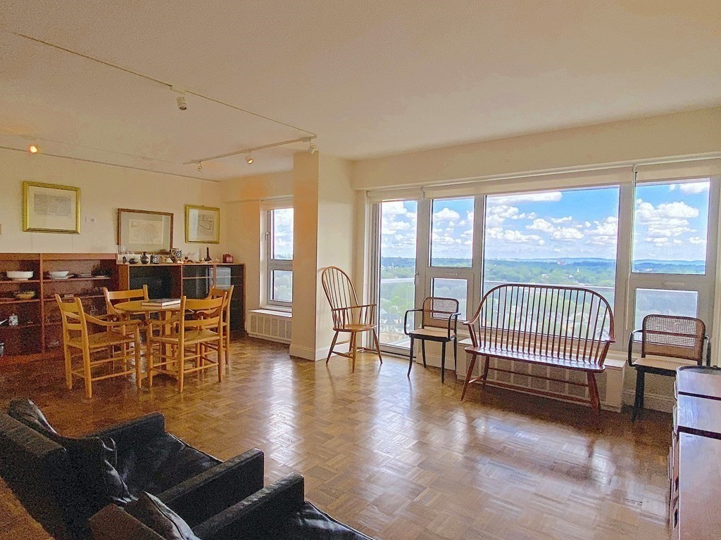 111 Perkins Street, Unit 186 Boston, MA 02130 - Photo 2 of 34 a living room with furniture and a floor to ceiling window