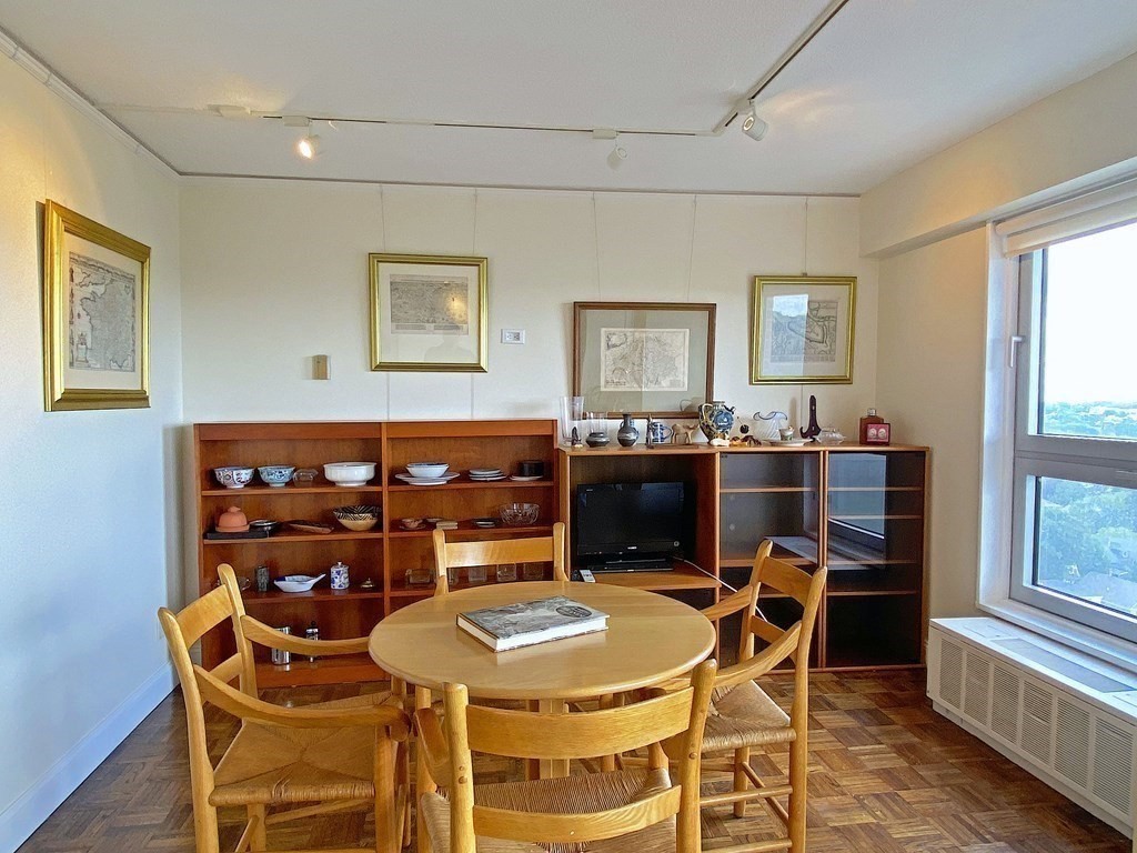 111 Perkins Street, Unit 186 Boston, MA 02130 - Photo 4 of 34 a view of a dining room with furniture and window