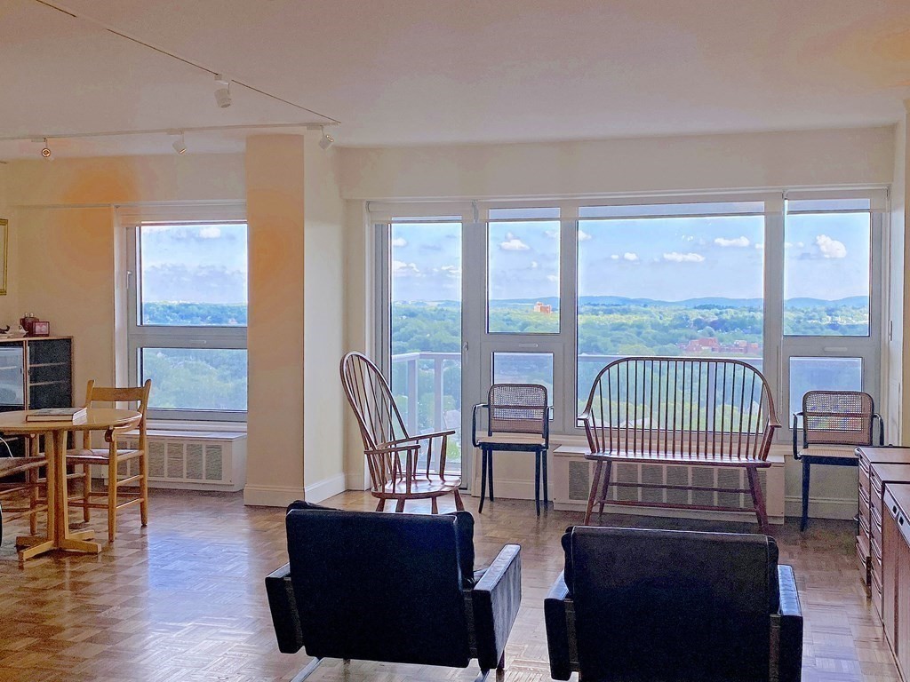 111 Perkins Street, Unit 186 Boston, MA 02130 - Photo 9 of 34 a view of a livingroom with furniture wooden floor and windows