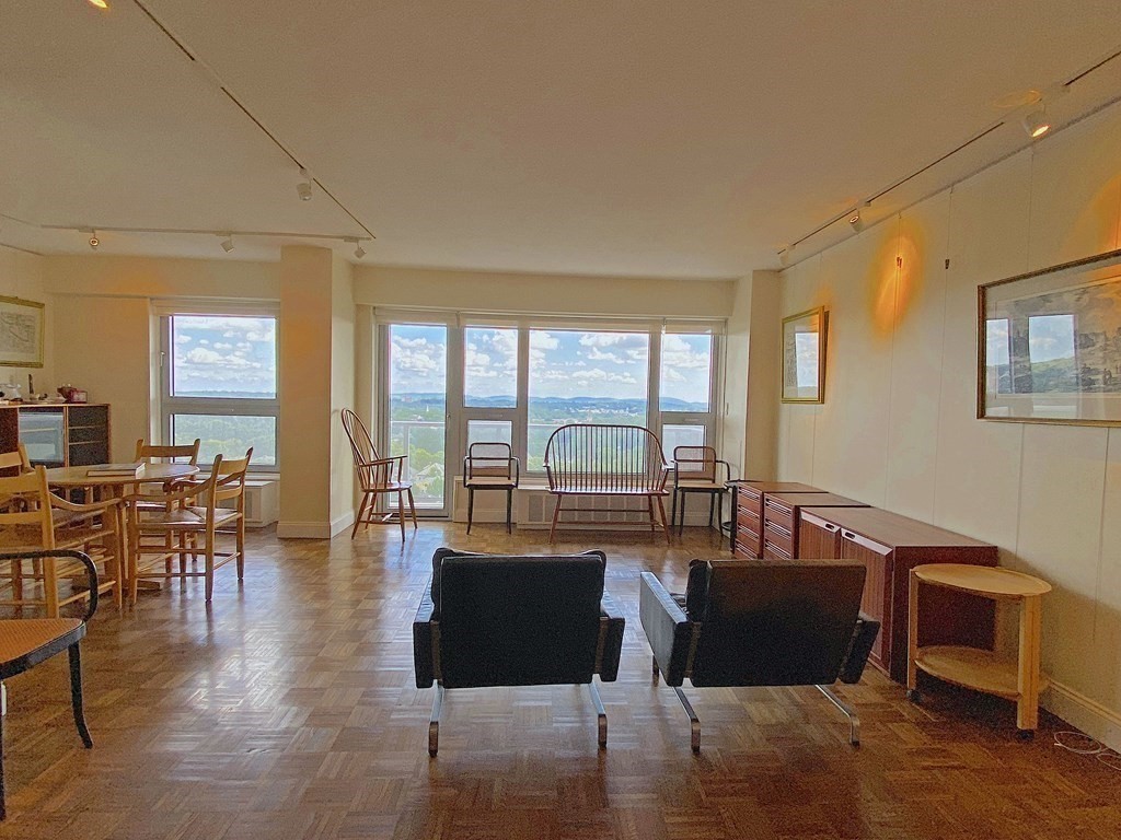 111 Perkins Street, Unit 186 Boston, MA 02130 - Photo 10 of 34 a living room with furniture floor to ceiling window and wooden floor
