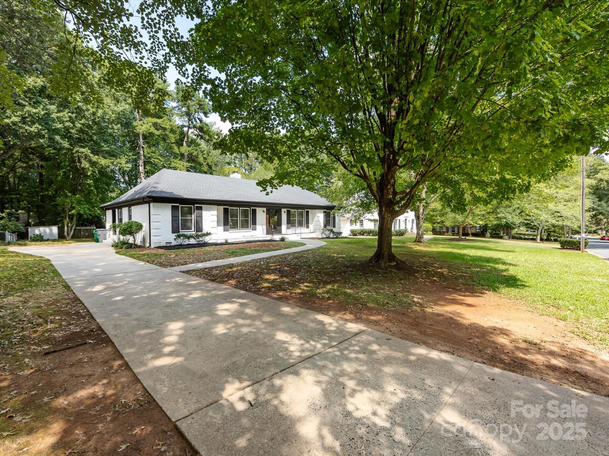6017 Brace Road Charlotte, NC 28211 - Photo 2 of 47 a front view of a house with a yard