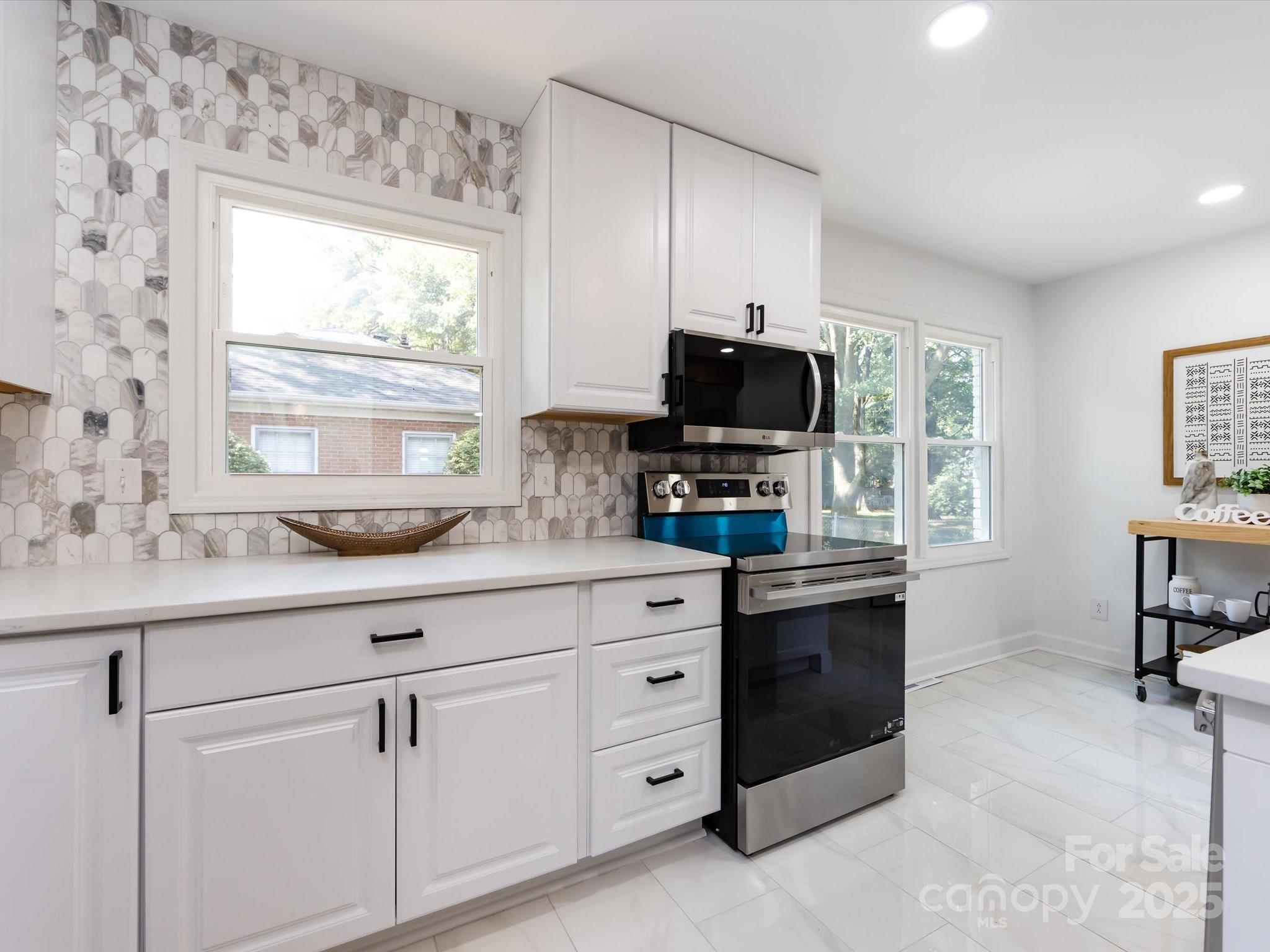 6017 Brace Road Charlotte, NC 28211 - Photo 22 of 47 a kitchen with cabinets appliances and a window