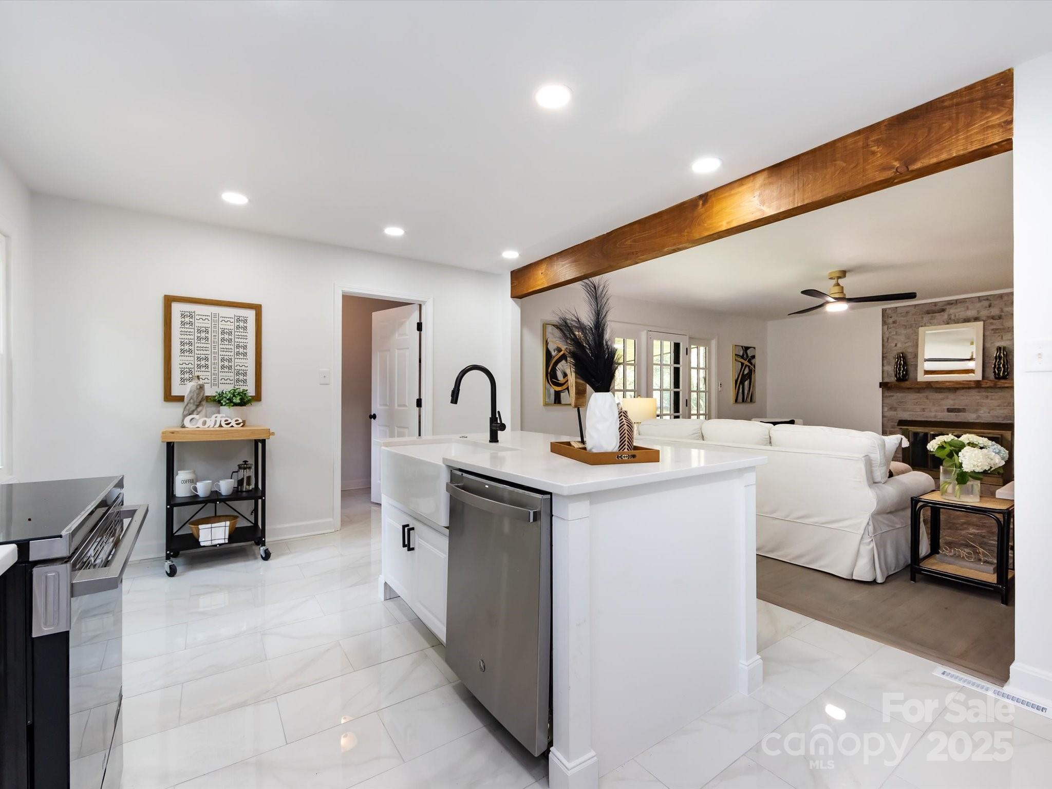 6017 Brace Road Charlotte, NC 28211 - Photo 23 of 47 a living room with furniture a dining table and chairs with kitchen view