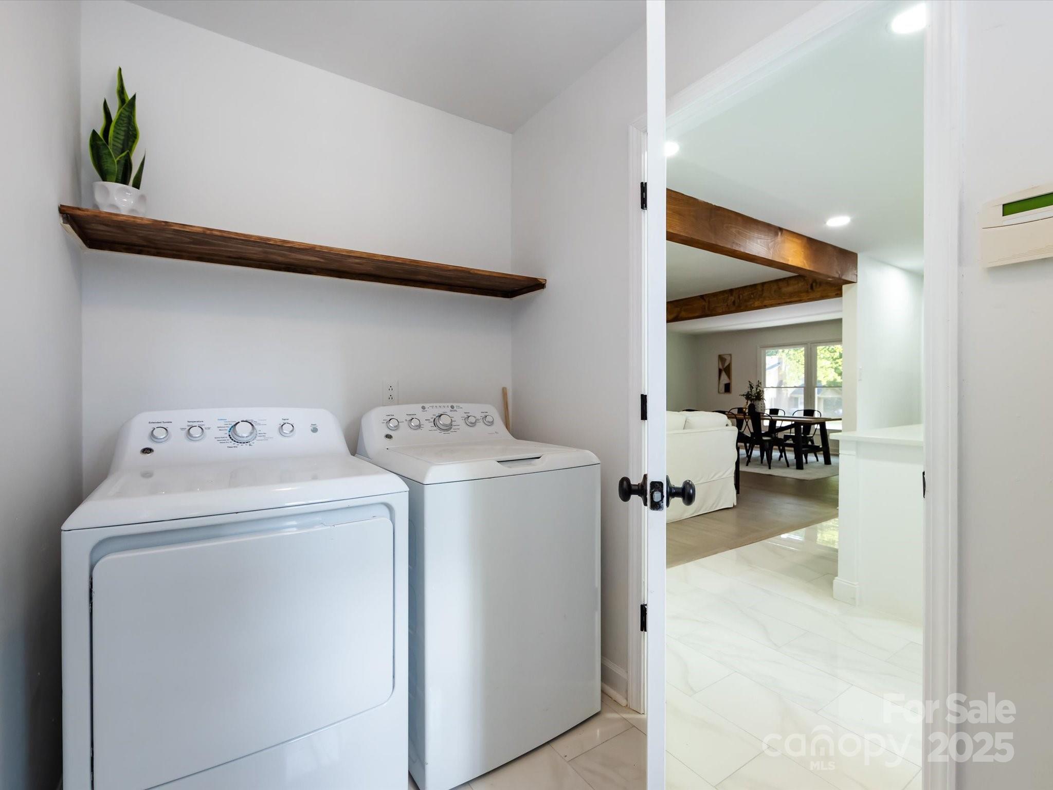 6017 Brace Road Charlotte, NC 28211 - Photo 24 of 47 a utility room with dryer and washer