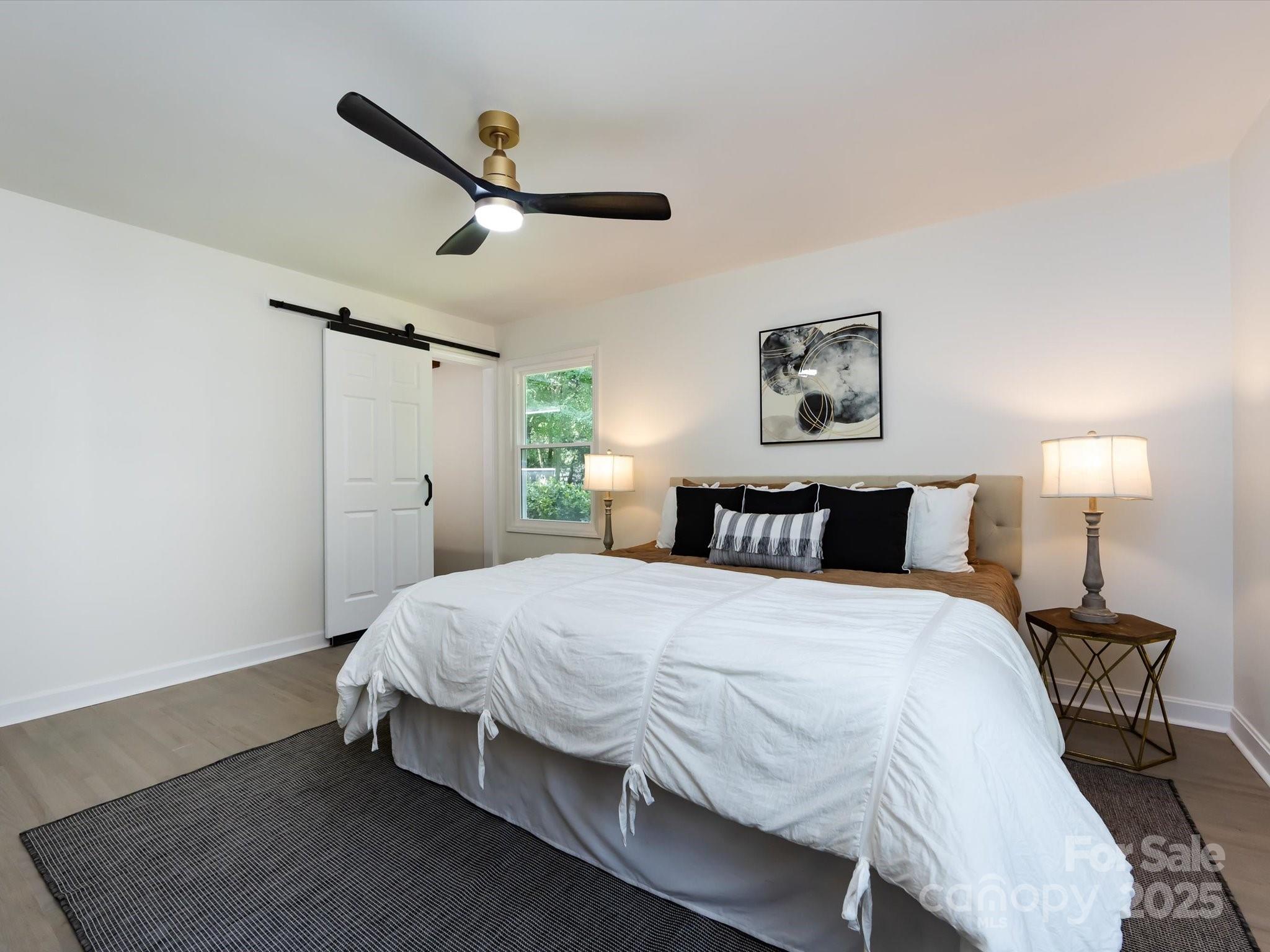 6017 Brace Road Charlotte, NC 28211 - Photo 27 of 47 a bedroom with a bed and a window