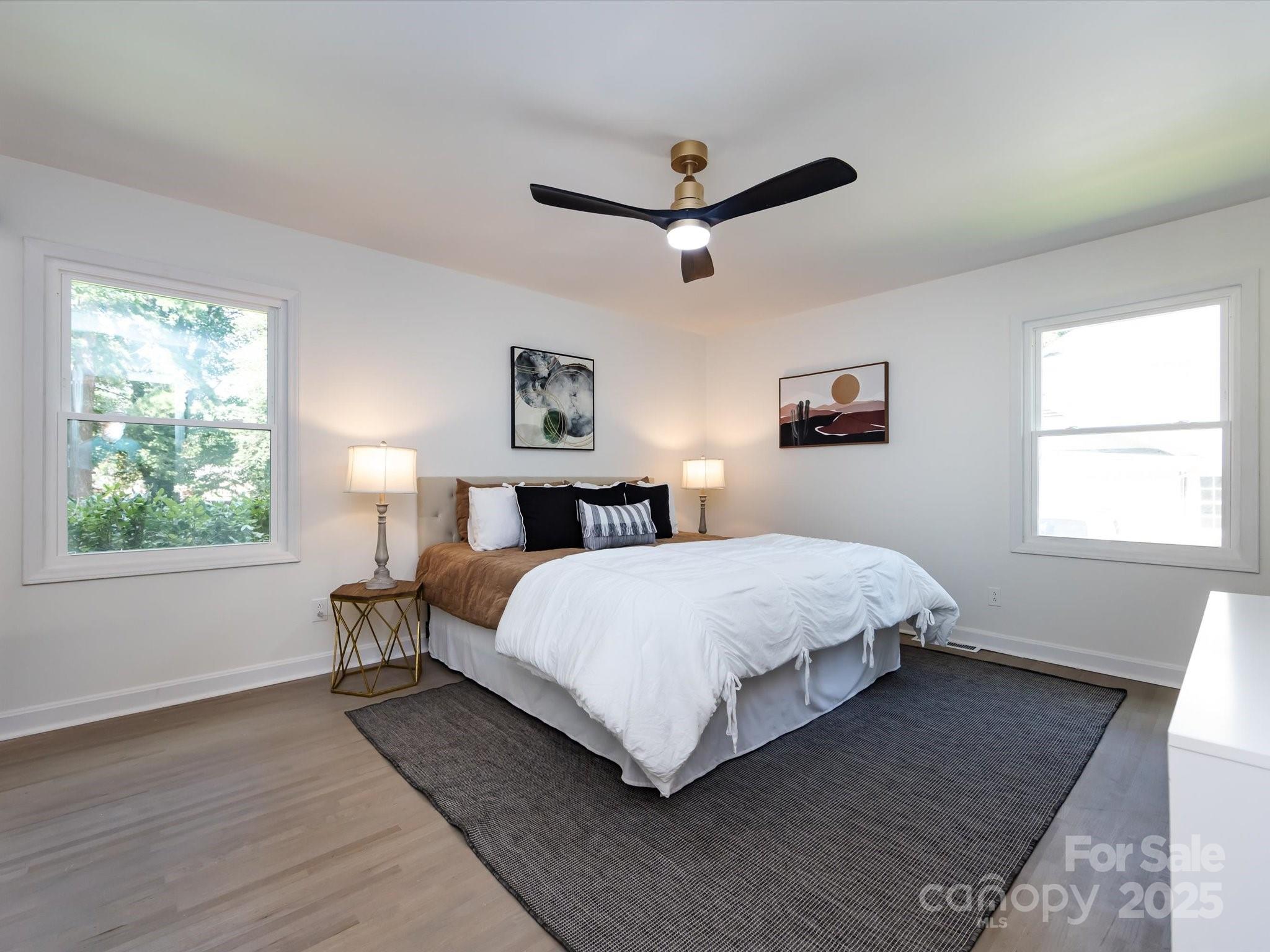 6017 Brace Road Charlotte, NC 28211 - Photo 28 of 47 a bedroom with a bed lamp and window