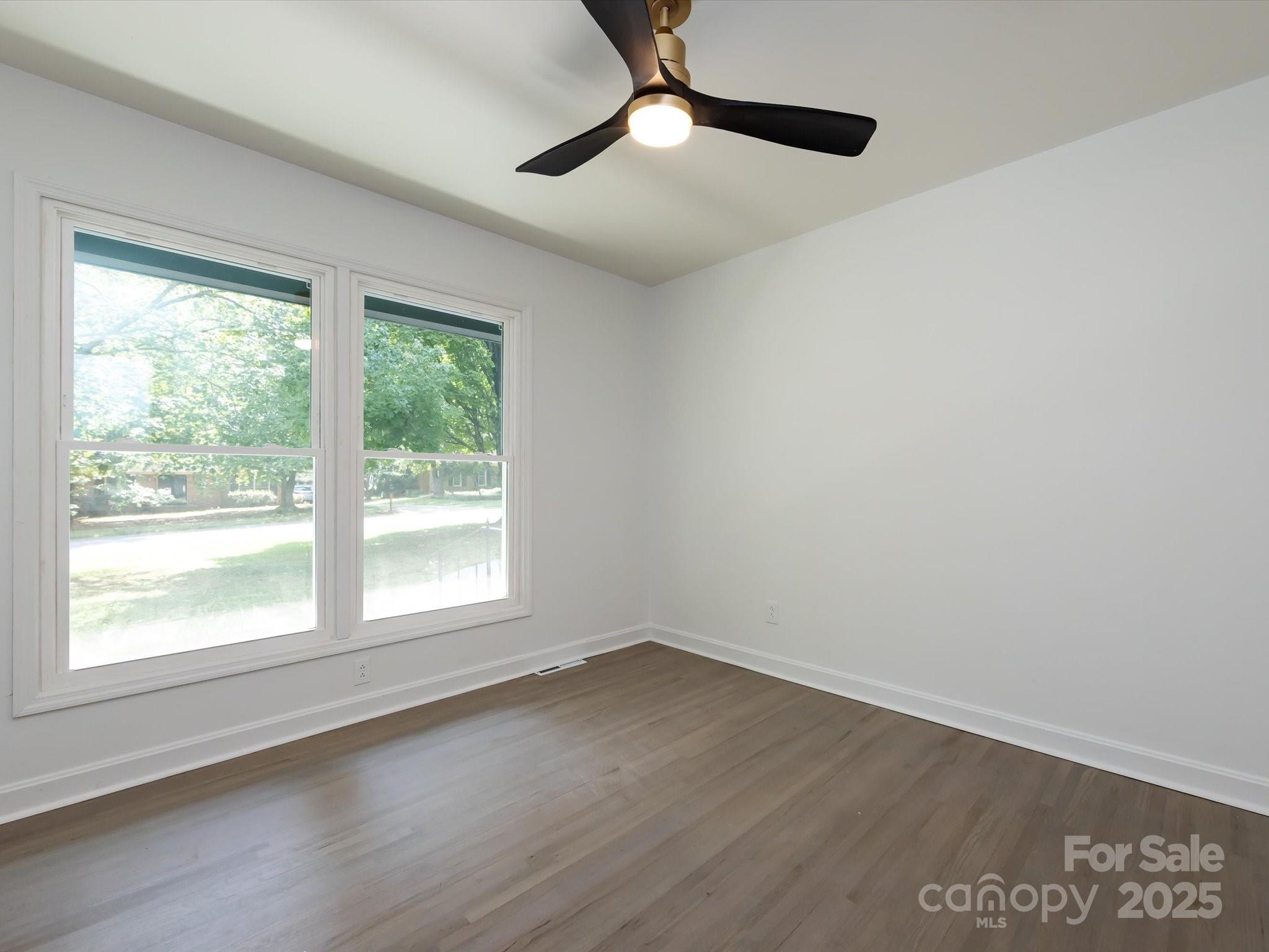 6017 Brace Road Charlotte, NC 28211 - Photo 33 of 47 wooden floor in an empty room with a window