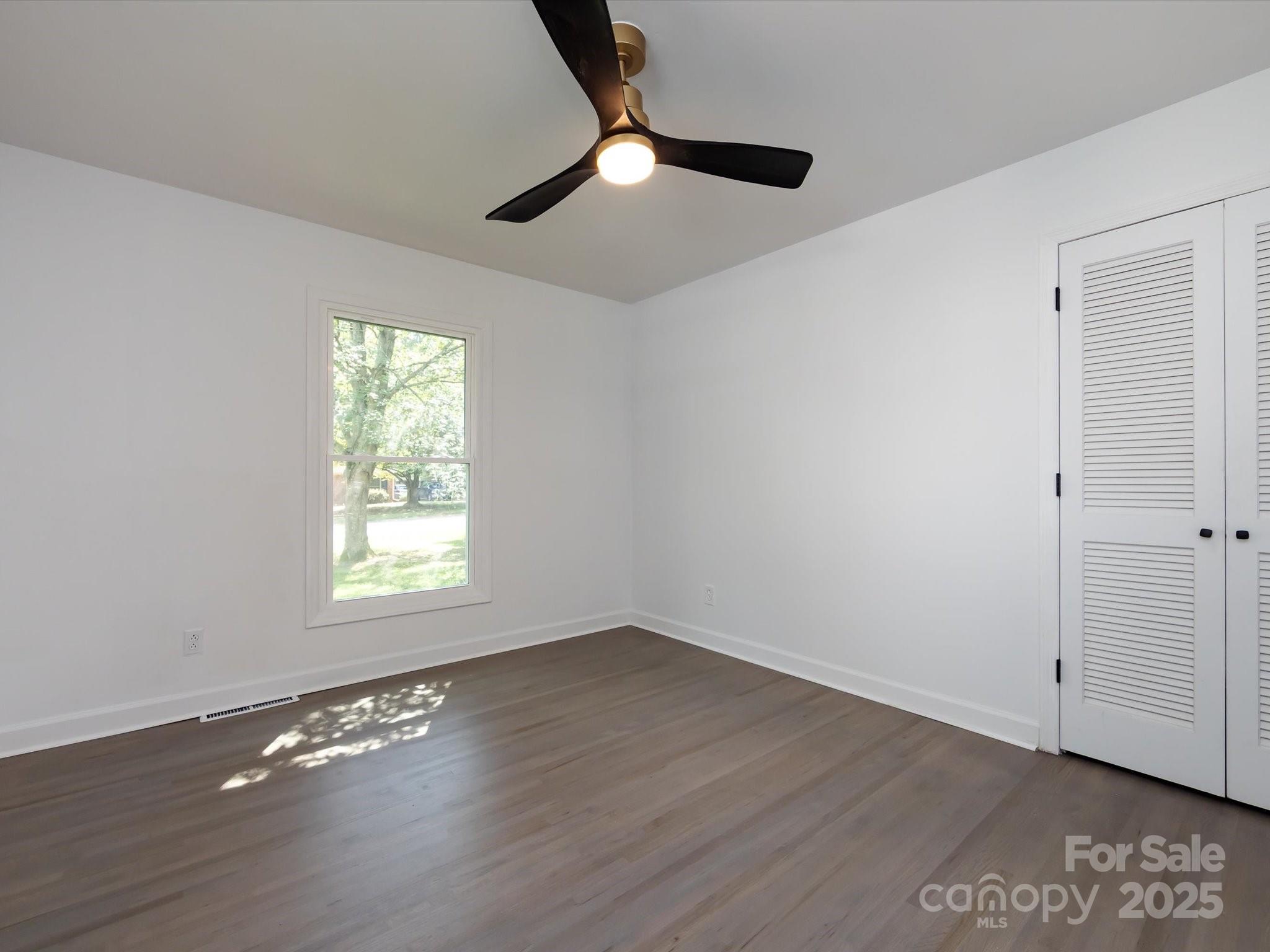 6017 Brace Road Charlotte, NC 28211 - Photo 38 of 47 wooden floor in an empty room with a window