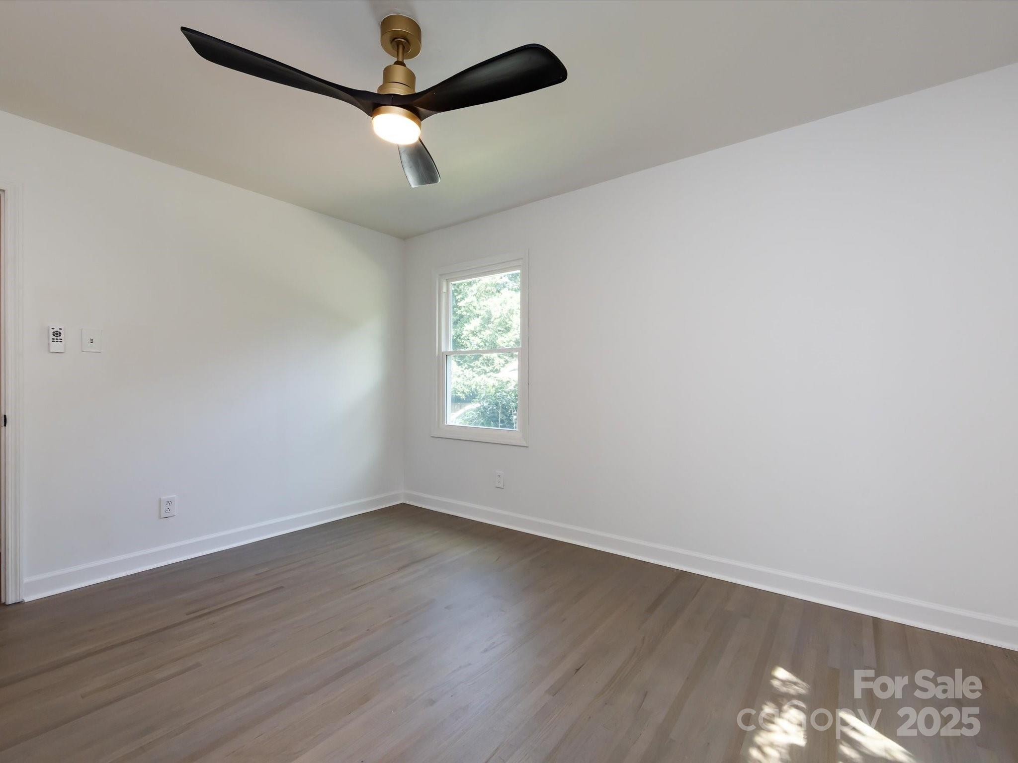 6017 Brace Road Charlotte, NC 28211 - Photo 39 of 47 wooden floor in an empty room with a window