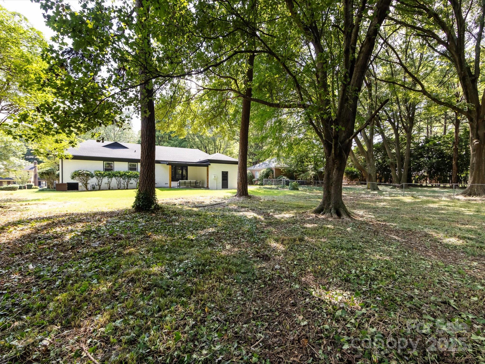 6017 Brace Road Charlotte, NC 28211 - Photo 43 of 47 a view of a house with a yard