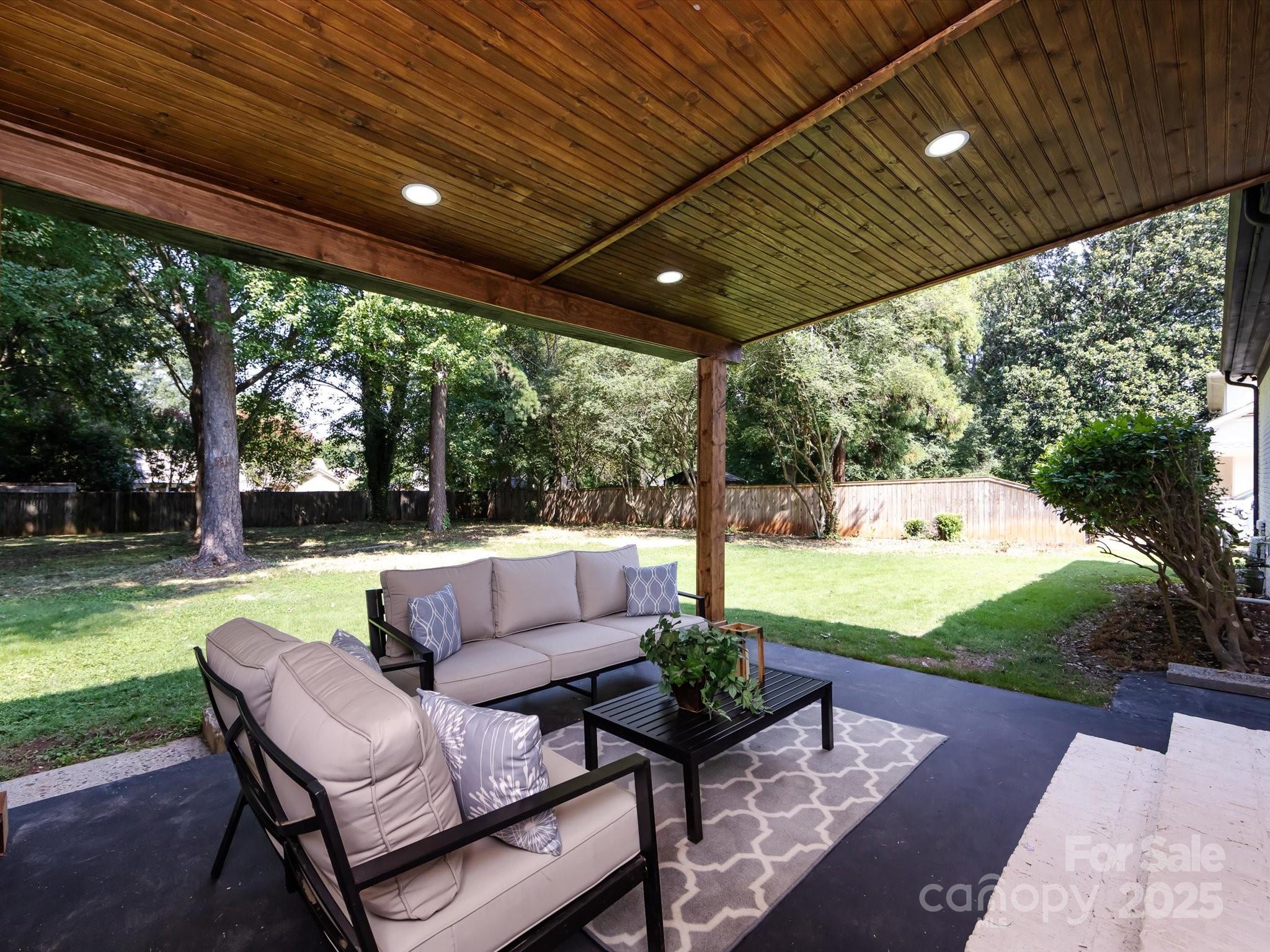 6017 Brace Road Charlotte, NC 28211 - Photo 47 of 47 a patio with garden area and outdoor seating