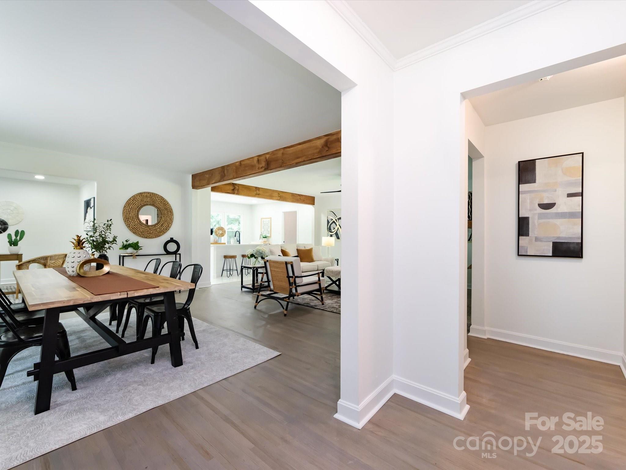6017 Brace Road Charlotte, NC 28211 - Photo 7 of 47 a dining room with wooden floor and a table