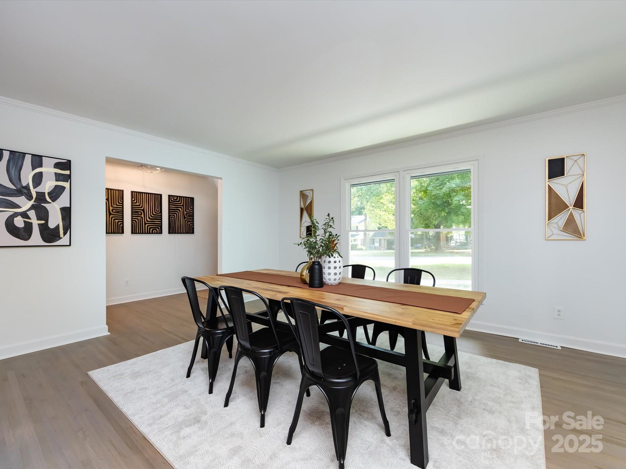 6017 Brace Road Charlotte, NC 28211 - Photo 8 of 47 a view of a dining room with furniture and wooden floor