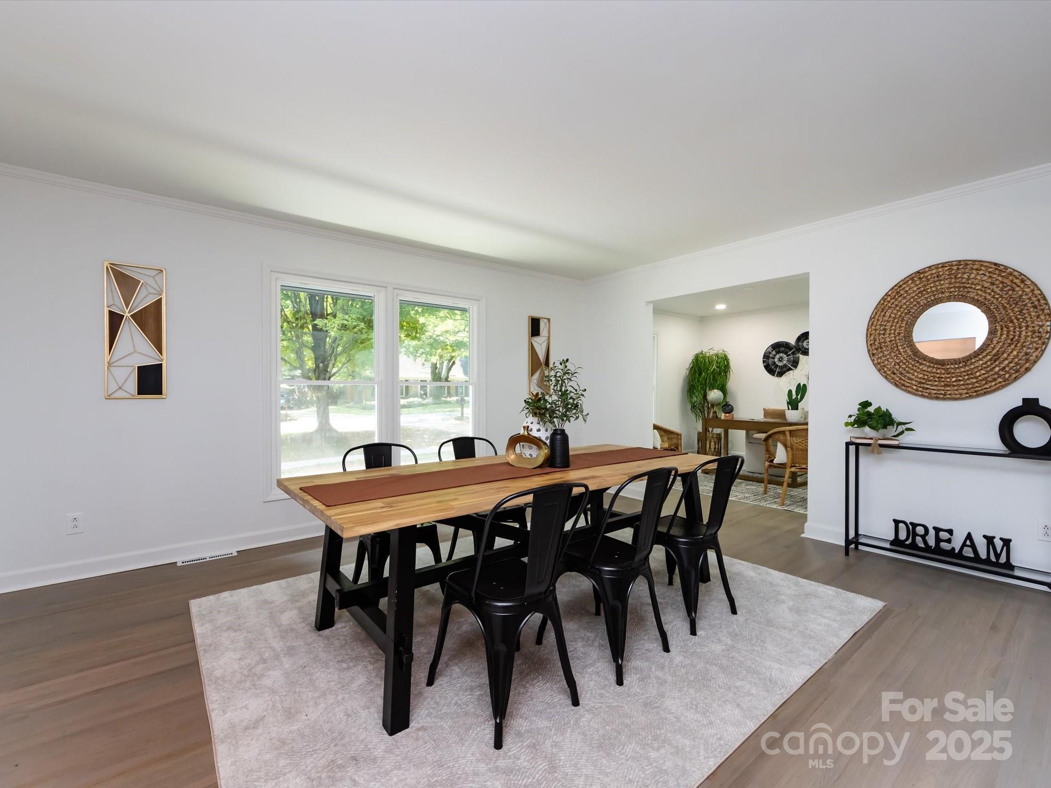 6017 Brace Road Charlotte, NC 28211 - Photo 9 of 47 a view of a dining room with furniture and wooden floor