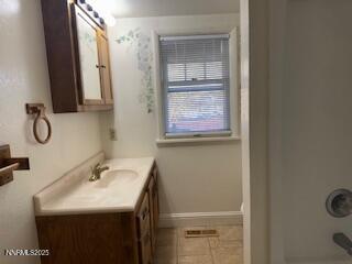 812 Lander Street, Unit A Reno, NV 89509 - Photo 11 of 24 a bathroom with a granite countertop sink and a mirror