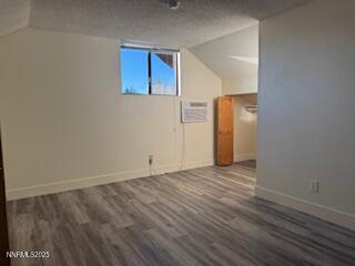 812 Lander Street, Unit A Reno, NV 89509 - Photo 13 of 24 a view of an empty room with wooden floor and a window