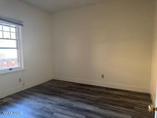 812 Lander Street, Unit A Reno, NV 89509 - Photo 16 of 24 an empty room with wooden floor and windows