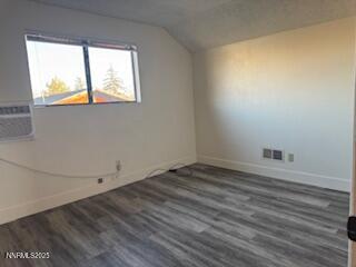 812 Lander Street, Unit A Reno, NV 89509 - Photo 19 of 24 a view of an empty room and wooden floor