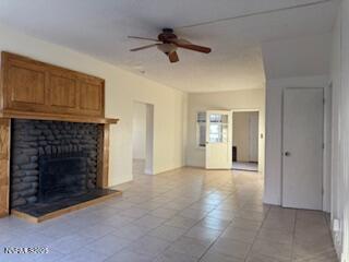 812 Lander Street, Unit A Reno, NV 89509 - Photo 3 of 24 a view of an empty room with a fireplace and a window