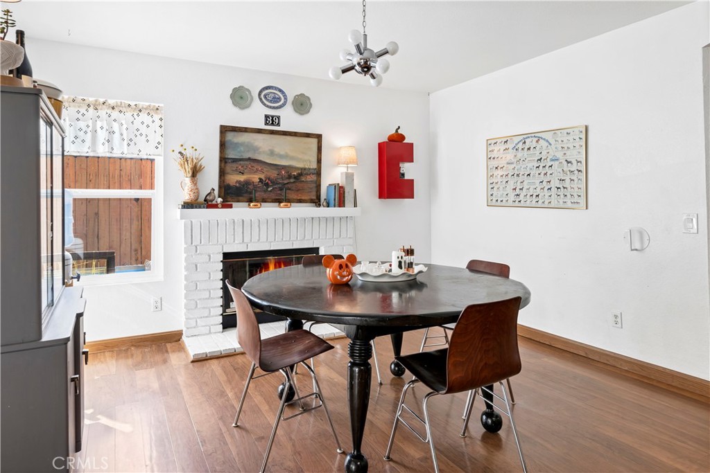 44882 Tehachapi Pass Temecula, CA 92592 - Photo 11 of 34 a view of a dining room with furniture window and wooden floor