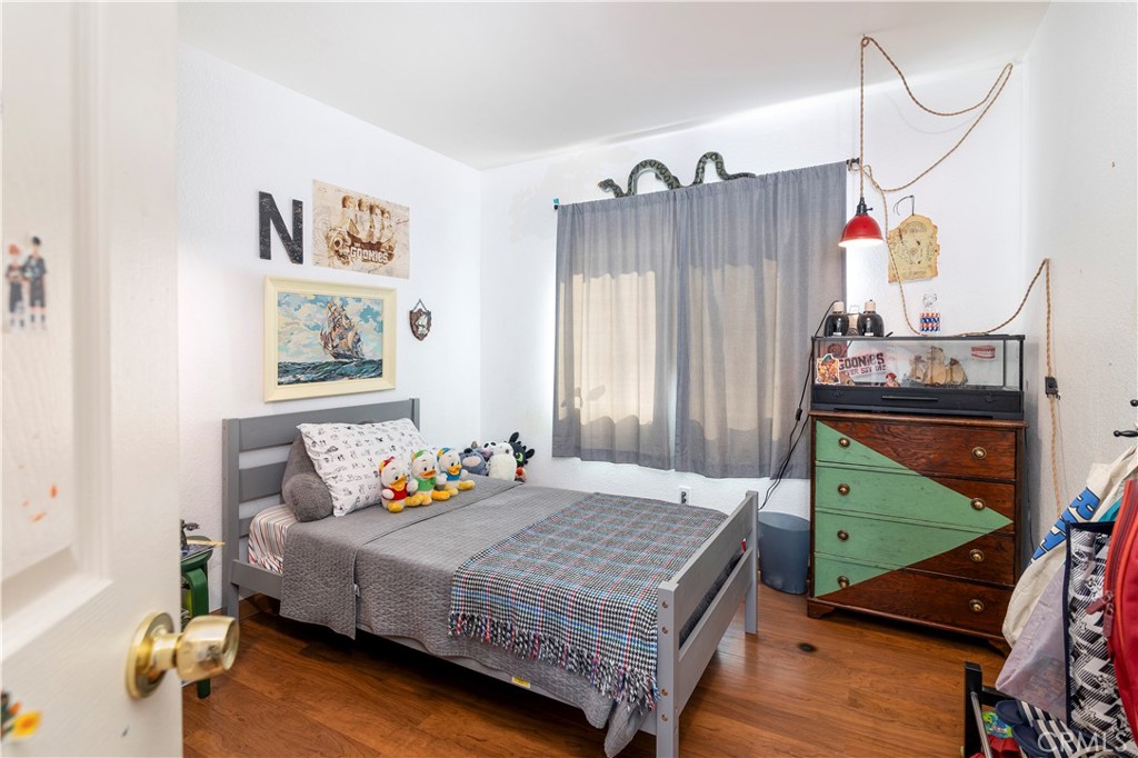 44882 Tehachapi Pass Temecula, CA 92592 - Photo 18 of 34 a bedroom with a bed and window