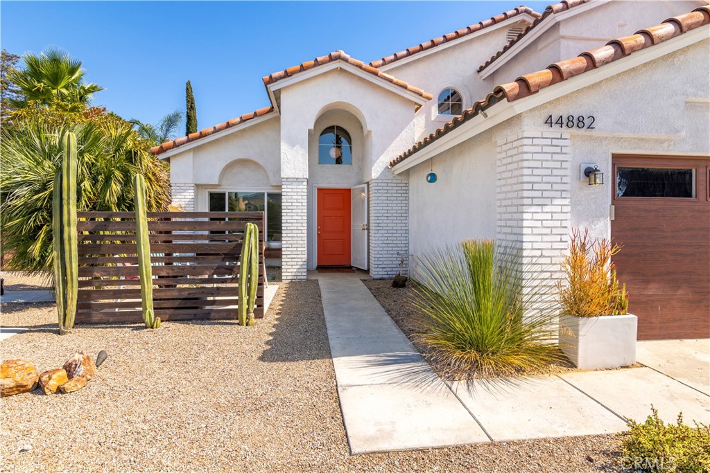 44882 Tehachapi Pass Temecula, CA 92592 - Photo 2 of 34 a view of a house with a potted plant