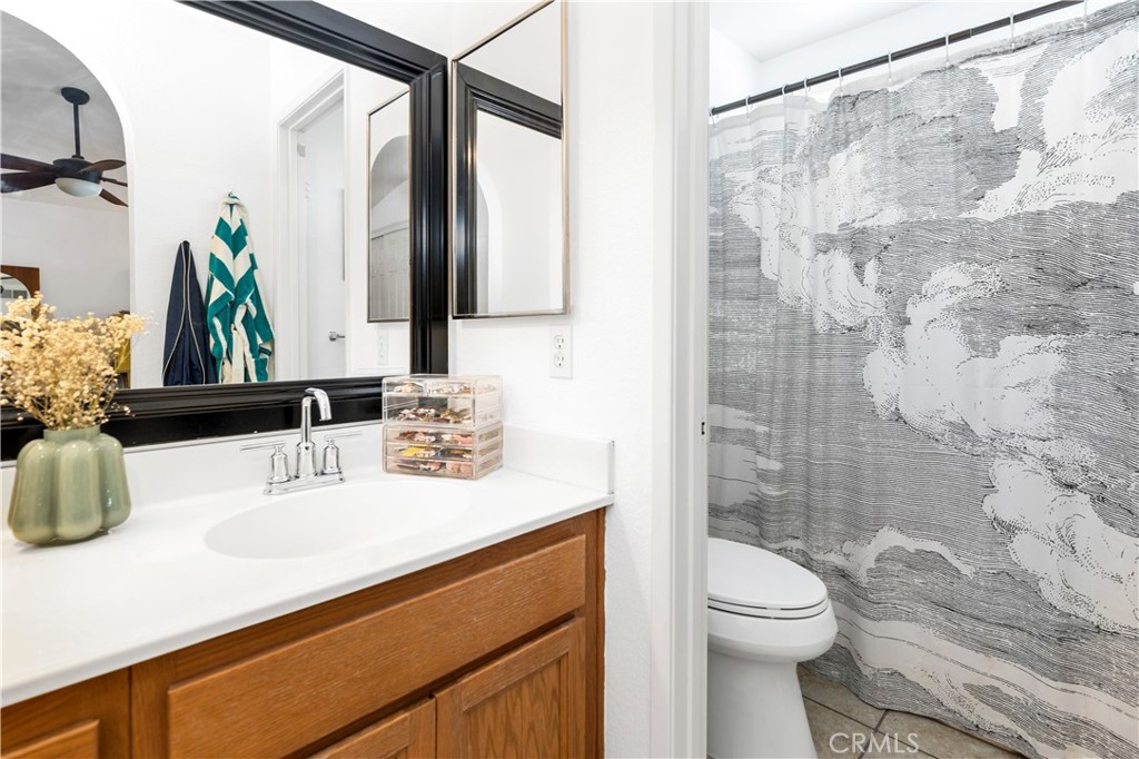 44882 Tehachapi Pass Temecula, CA 92592 - Photo 24 of 34 a bathroom with a sink a toilet and shower