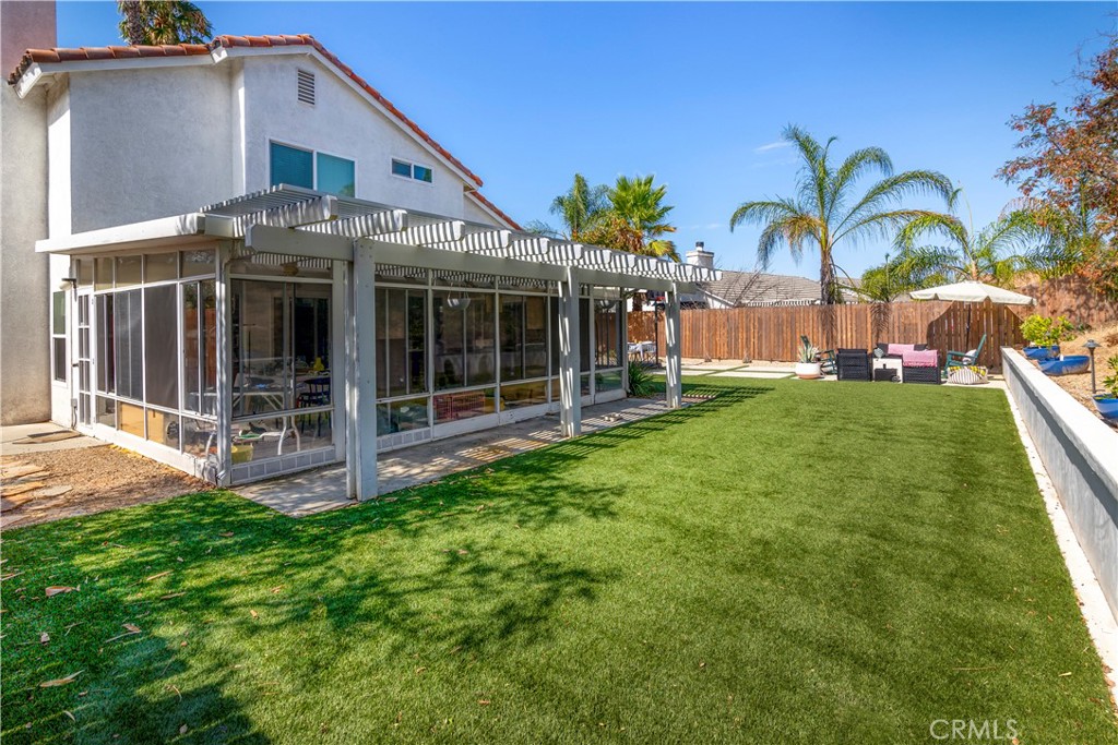 44882 Tehachapi Pass Temecula, CA 92592 - Photo 28 of 34 a view of a house with a yard and potted plants