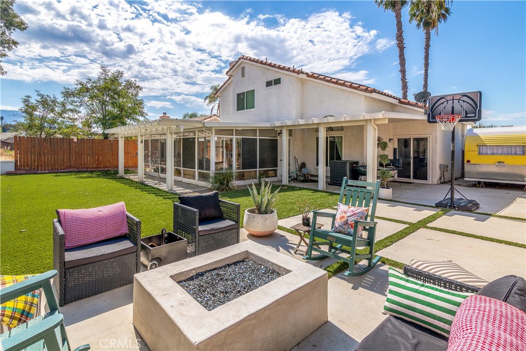 44882 Tehachapi Pass Temecula, CA 92592 - Photo 29 of 34 a view of a patio with couches table and chairs with wooden floor and fence
