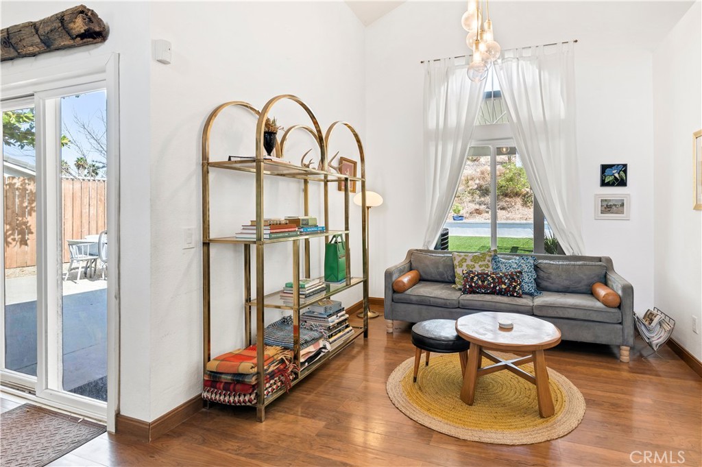 44882 Tehachapi Pass Temecula, CA 92592 - Photo 7 of 34 a living room with furniture chess table and a large window