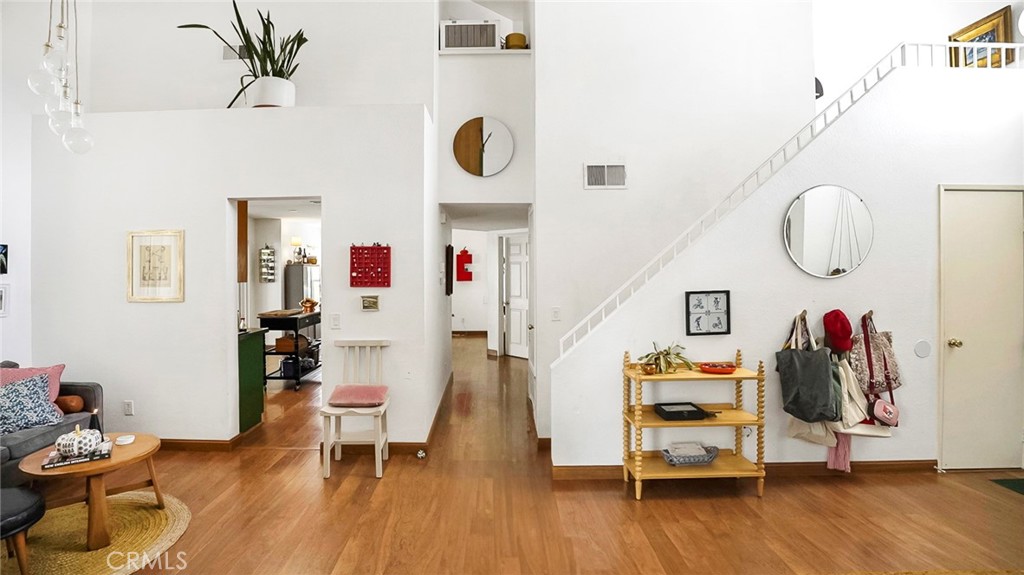 44882 Tehachapi Pass Temecula, CA 92592 - Photo 8 of 34 a living room with furniture and a wooden floor