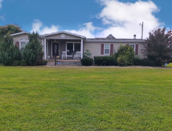 107 New Deal Potts Road Cottontown, TN 37048 - Photo 1 of 31 a front view of a house with garden