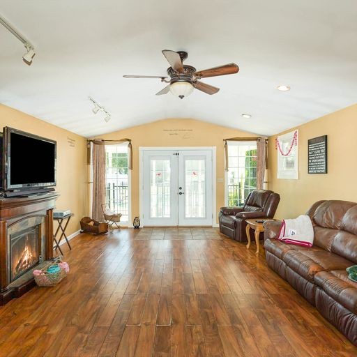 107 New Deal Potts Road Cottontown, TN 37048 - Photo 27 of 31 a living room with furniture fireplace and flat screen tv