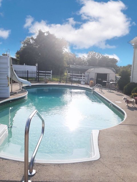 107 New Deal Potts Road Cottontown, TN 37048 - Photo 4 of 31 a view of a swimming pool with outdoor seating and plants