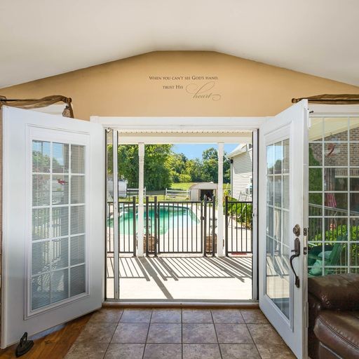 107 New Deal Potts Road Cottontown, TN 37048 - Photo 8 of 31 a view of a porch with a floor to ceiling window
