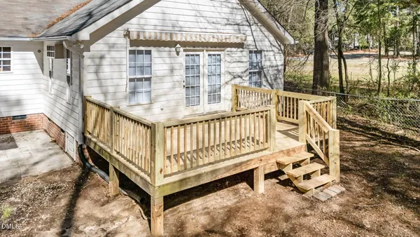 a view of a porch with a floor to ceiling window