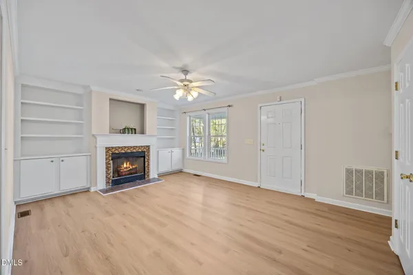 wooden floor in an empty room with a window