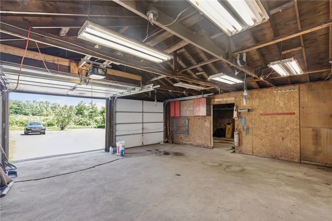 62 Stoney Road Tamaqua, PA 18252 - Photo 50 of 61 A well-lit garage offers ample space for vehicles and storage with direct access to the outdoors.