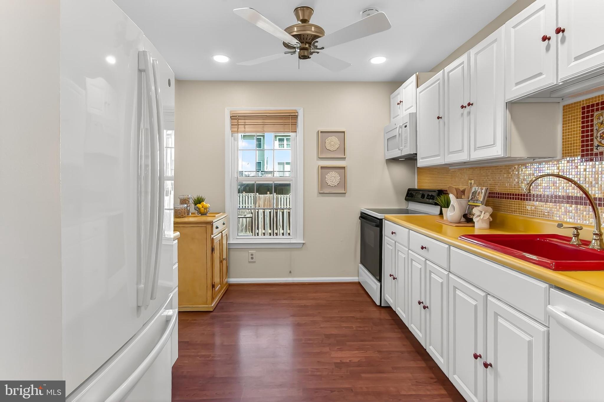 2810 Andiron Lane Vienna, VA 22180 - Photo 11 of 37 a kitchen with sink a counter top space and cabinets