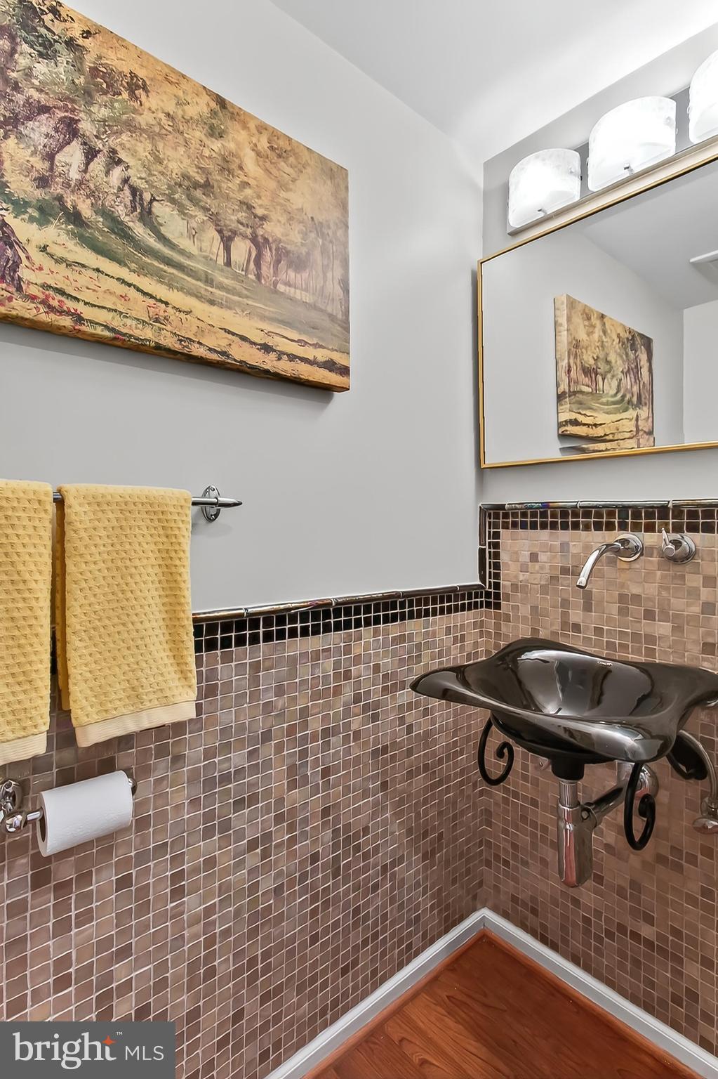 2810 Andiron Lane Vienna, VA 22180 - Photo 16 of 37 a bathroom with a sink and a mirror