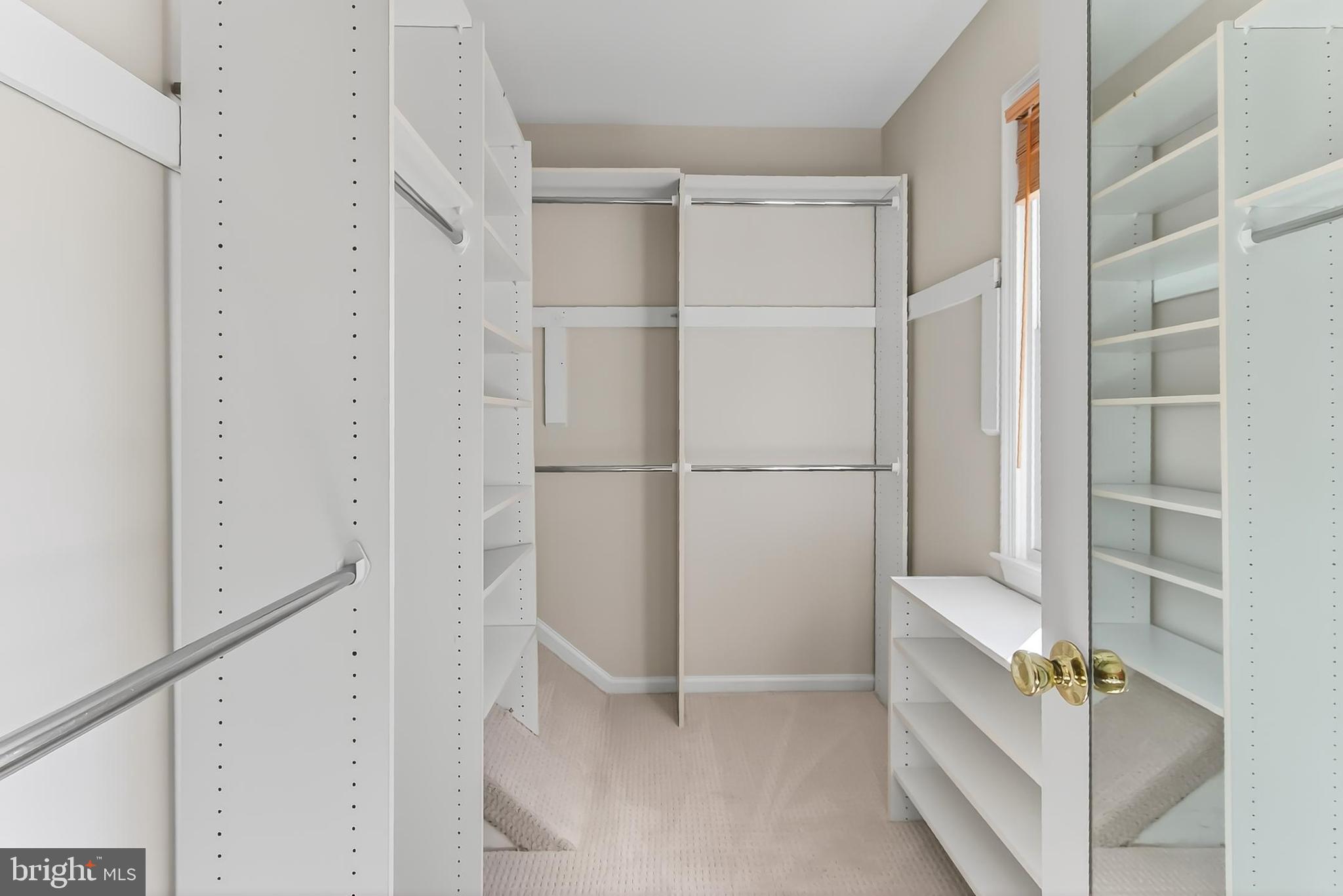 2810 Andiron Lane Vienna, VA 22180 - Photo 20 of 37 a view of walk in closet with empty racks