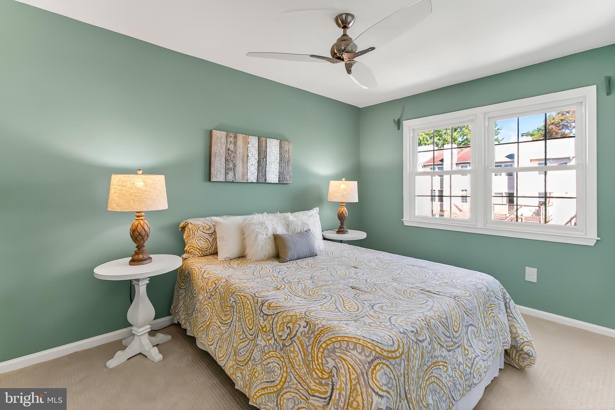 2810 Andiron Lane Vienna, VA 22180 - Photo 21 of 37 a bedroom with a bed and a window