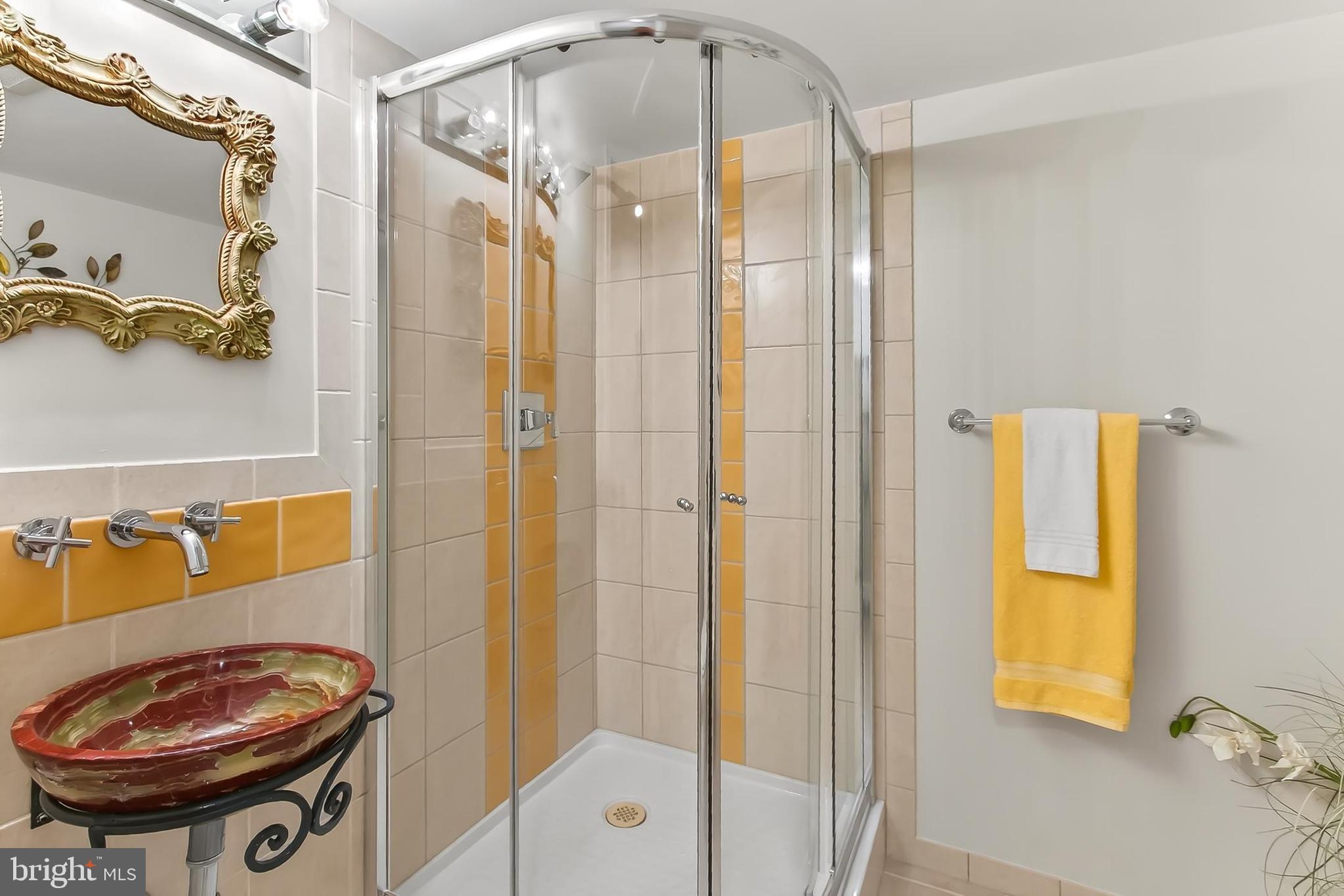 2810 Andiron Lane Vienna, VA 22180 - Photo 29 of 37 a bathroom with a sink and a mirror