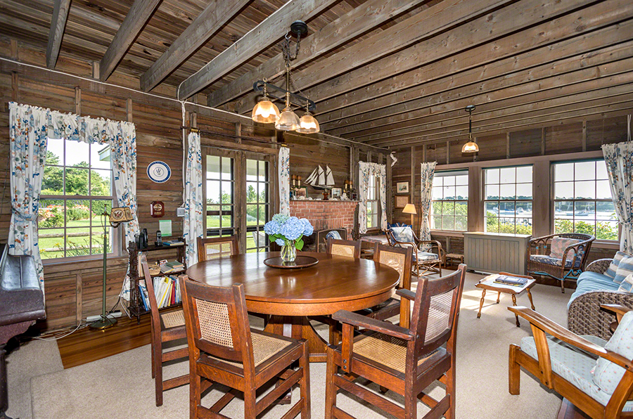 44 Green Hollow Road Edgartown, MA 02539 - Photo 13 of 45 a view of a dining room with furniture wooden floor and chandelier