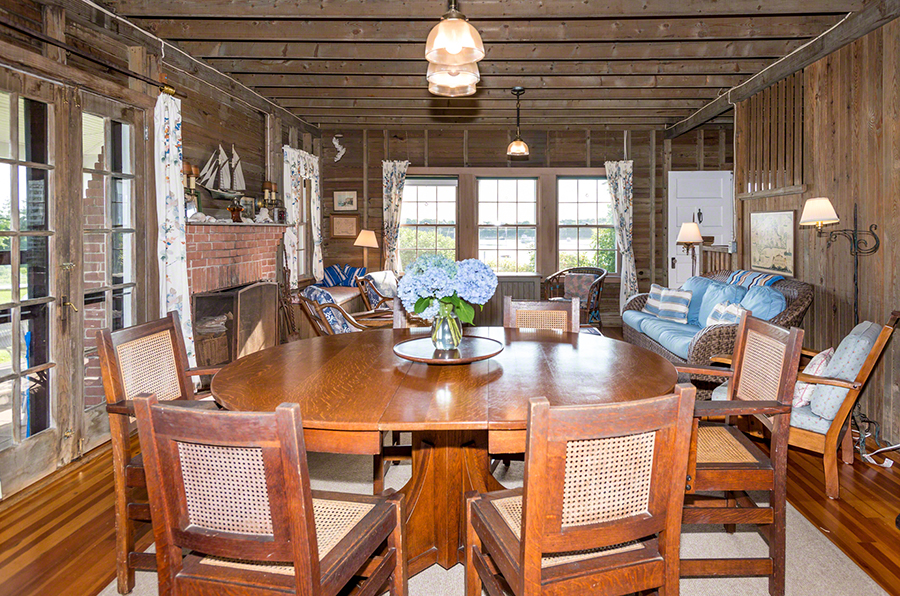 44 Green Hollow Road Edgartown, MA 02539 - Photo 17 of 45 a view of a dining room with furniture a chandelier and wooden floor