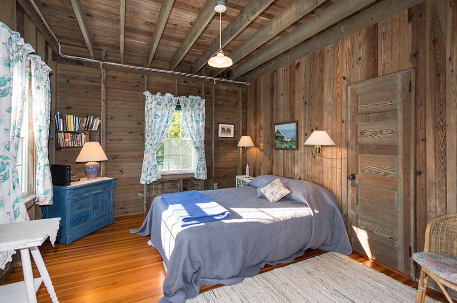 44 Green Hollow Road Edgartown, MA 02539 - Photo 24 of 45 a bed sitting in a bedroom next to a window