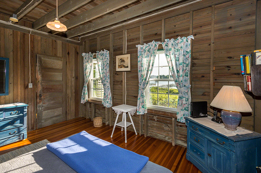 44 Green Hollow Road Edgartown, MA 02539 - Photo 25 of 45 a living room with furniture a flat screen tv and a table