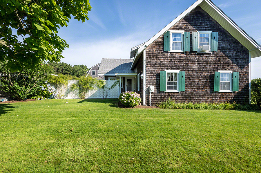44 Green Hollow Road Edgartown, MA 02539 - Photo 39 of 45 a front view of a house with a garden