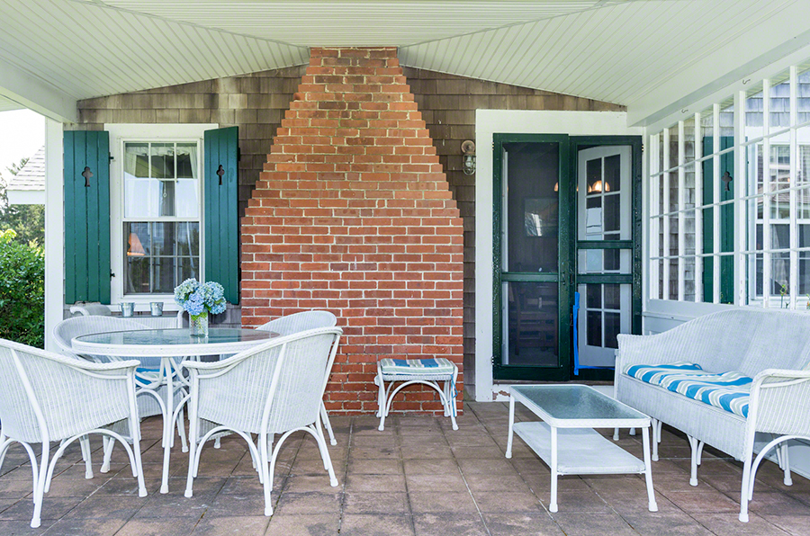 44 Green Hollow Road Edgartown, MA 02539 - Photo 10 of 45 a patio with table and chairs